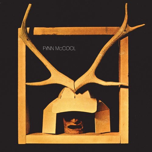 CD cover with antlers above a geometric, wooden structure on black.