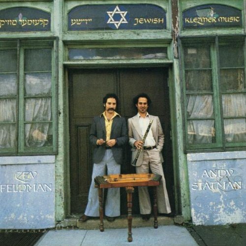"Album cover with two men standing in a doorway, holding musical instruments."