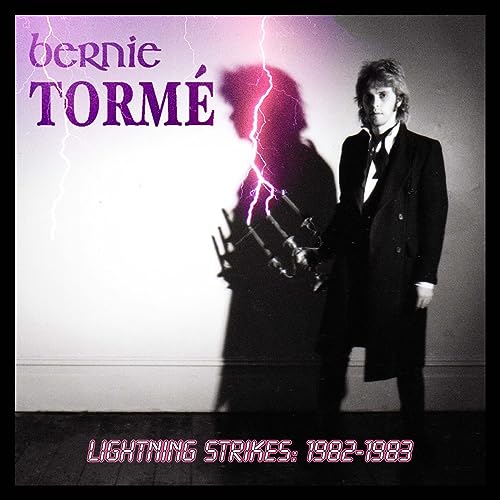 Bernie Torme album cover: musician in a suit with lightning imagery.