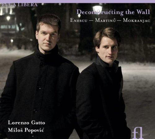"CD cover featuring two men in black coats standing back-to-back at night."