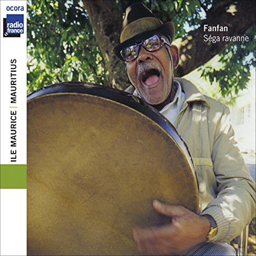 Man playing a large drum outdoors, CD cover for Fanfan’s Sega rav.