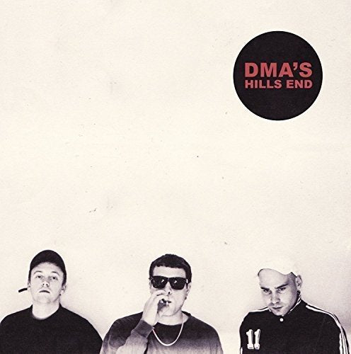 "Three men in black clothing, one smoking, below a black circle with 'DMA'S HILLS END' text."