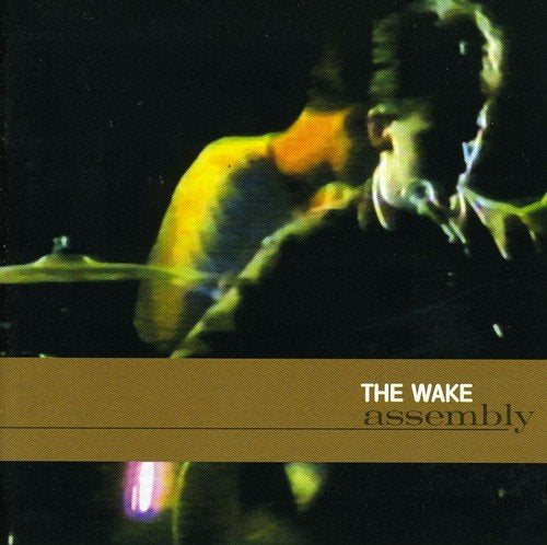 "CD cover with blurry image of musicians and 'THE WAKE assembly' text."