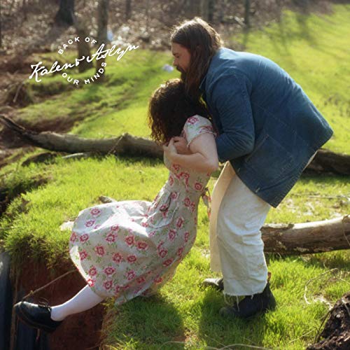CD cover featuring a couple embracing in a wooded area.