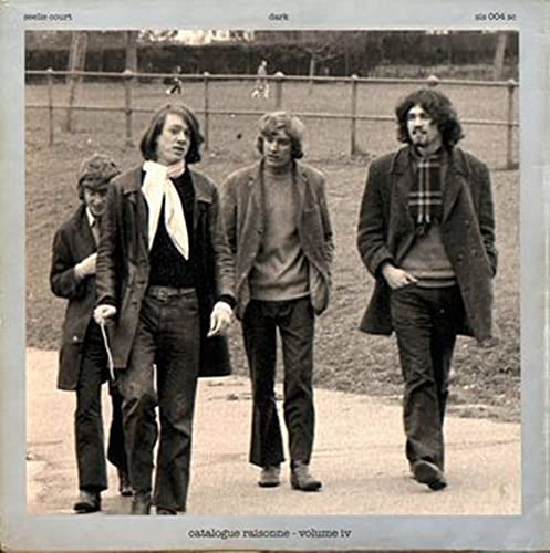 Black and white album cover featuring four casually dressed men outdoors.