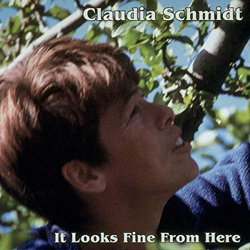 Album cover featuring a woman singing into a microphone surrounded by tree branches.