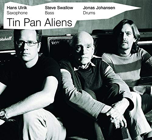 CD cover featuring three musicians in a studio setting.