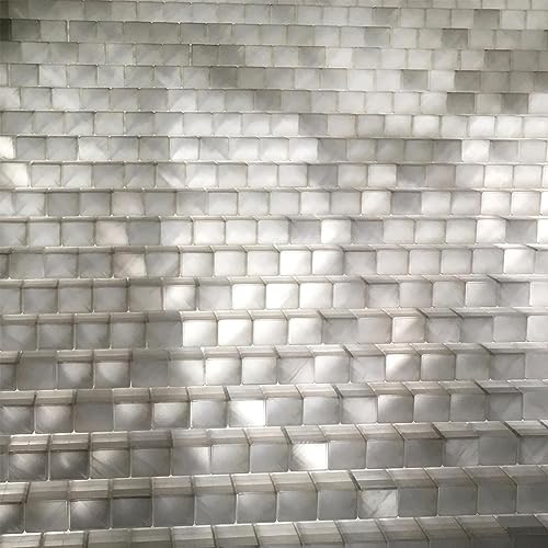 Abstract pattern of stacked, gray, rectangular blocks creating a textured surface.