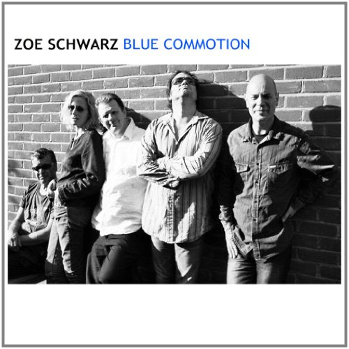"Album cover with five men standing against a brick wall, black and white photo."