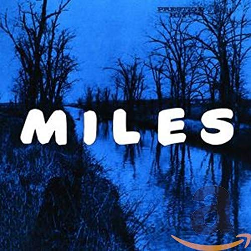 CD cover for Miles Davis album with blue trees and large text.