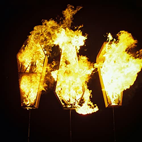Three coffin-shaped structures engulfed in bright yellow and orange flames.