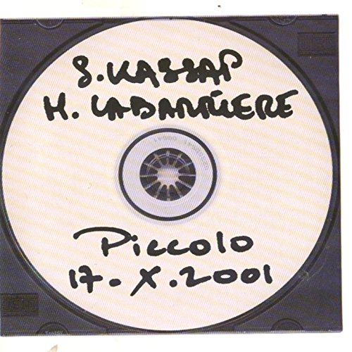 Handwritten CD with “Piccolo” title and date, against a dark background.