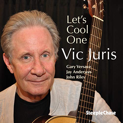 CD cover featuring a man holding a guitar against a black background.