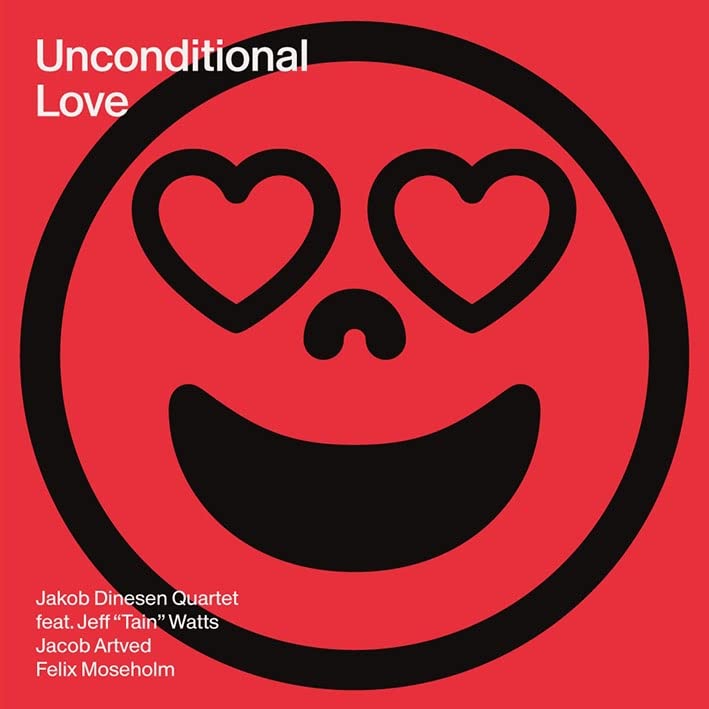 Red album cover with a black smiley face and two white hearts.