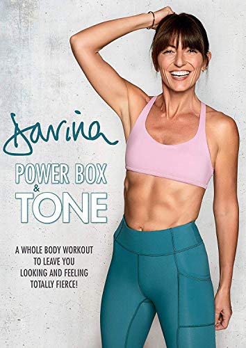The image shows a woman in workout attire. Alt text: Woman in pink sports bra and teal leggings posing against a grey background.