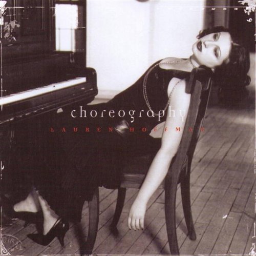 "Album cover with black and white photo of woman lying on the floor."