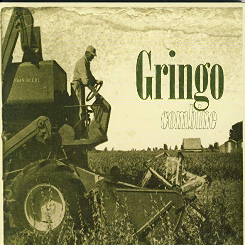 CD cover: man operating a John Deere combine harvester in a field.