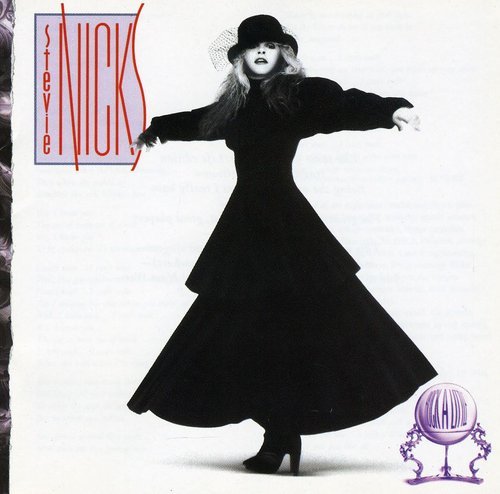 Stevie Nicks in black dress with outstretched arms, album cover.