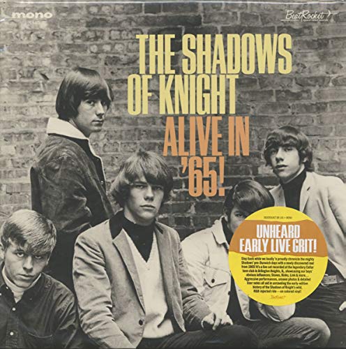 Vinyl album cover with a black-and-white band photo and yellow title text.
