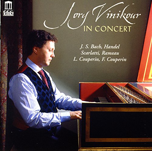 Man playing a harpsichord on the cover of a classical music CD.