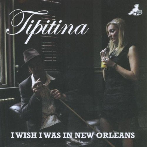 "Album cover with man and woman, 'Tipitina' in white cursive text at the top."