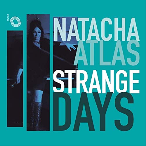 "Album cover for Natacha Atlas' 'Strange Days' with teal background and darkened artist image."