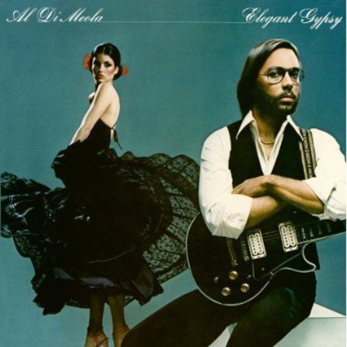 "Album cover featuring a man with a guitar and a woman in a black dress."