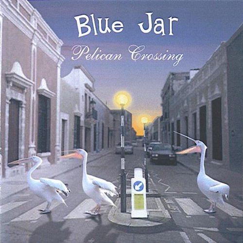 "Album cover featuring three pelicans crossing a street at dusk, with city buildings."