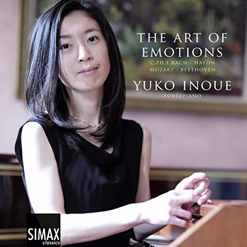 A woman plays a piano on a classical music CD cover.