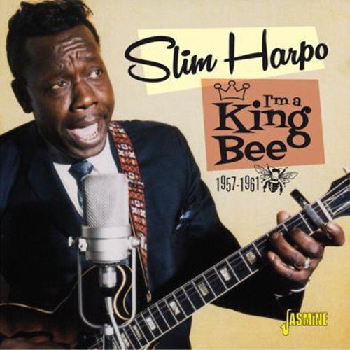 "CD cover with Slim Harpo holding a guitar and microphone, smiling."
