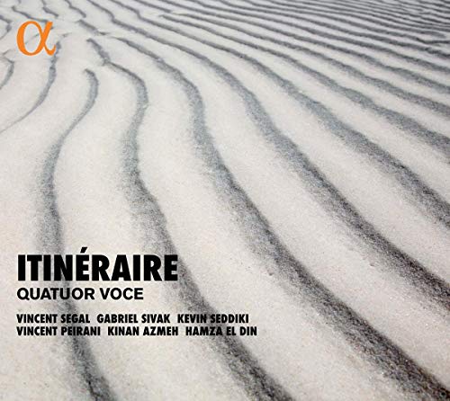 A CD cover featuring a sandy landscape with wavy patterns and artist names listed.
