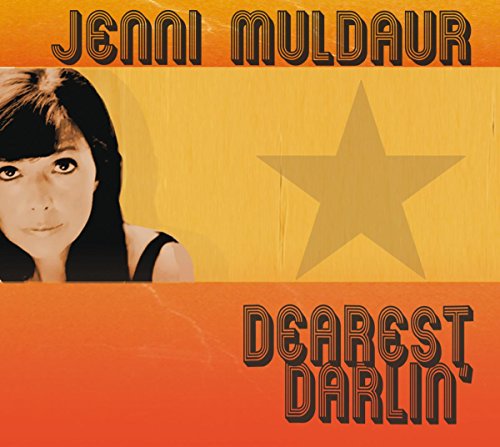 Album cover with a woman's portrait, yellow and orange background, and stylized text.