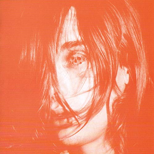 Orange album cover featuring a distorted, close-up portrait of a face.