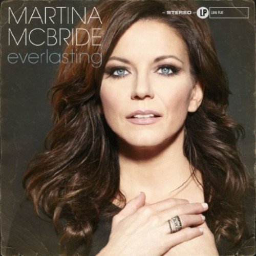 Martina McBride's album cover featuring her portrait with long brown hair and a ring.