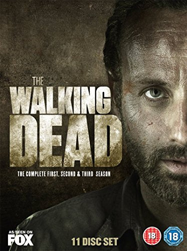 DVD cover for "The Walking Dead" showing a dirty, close-up face of a man.