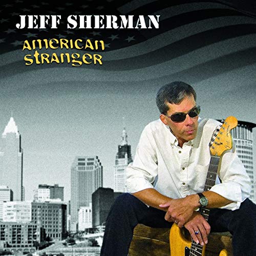 Jeff Sherman album cover: man with guitar, city skyline background.