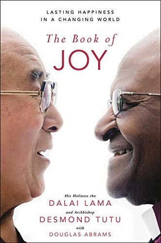 "The Book of Joy" cover featuring the Dalai Lama and Desmond Tutu facing each other, smiling.