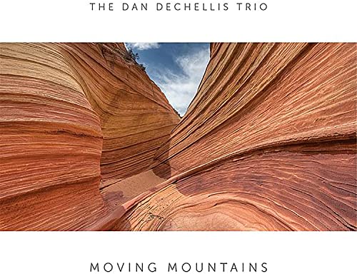 Album cover for “Moving Mountains” featuring a red rock canyon landscape.