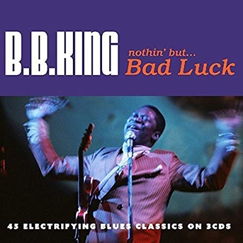 B.B. King performing on stage with a guitar and microphone on a CD cover.