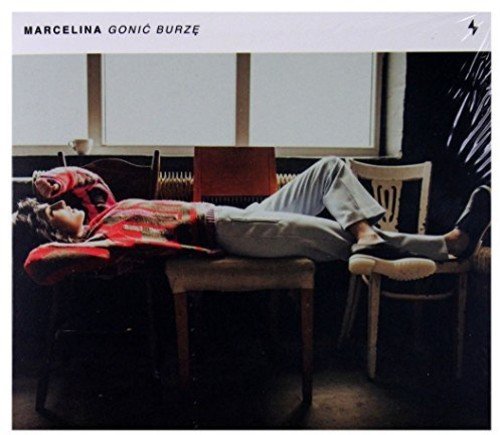 CD cover: person in red and white lies among chairs.