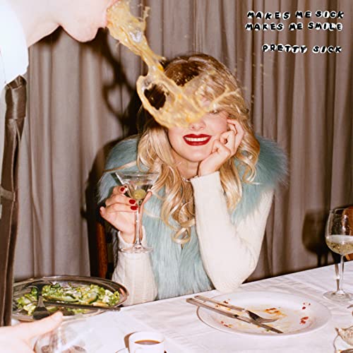 CD cover: woman with blonde hair, food spilling, holding a martini.