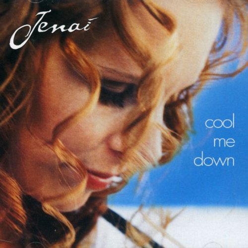 CD album cover featuring a close-up of a woman's face with wavy red hair.