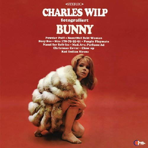 Red album cover featuring a woman in a fur coat, kneeling.