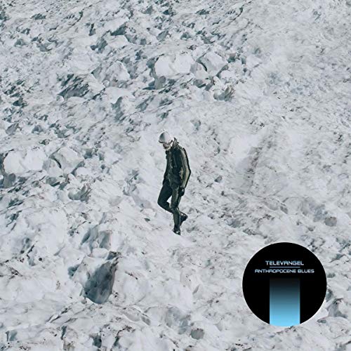 Person in dark clothing walks across a vast, icy, textured landscape.