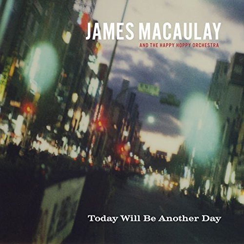 "Album cover with blurry city street at dusk, lights and text 'James Macaulay'."