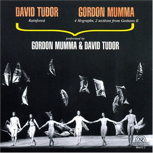 Black-and-white CD cover featuring dancers and silver shapes against a dark background.