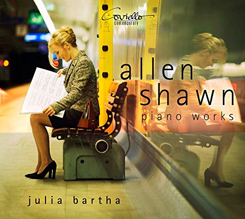 CD cover featuring pianist Julia Bartha with sheet music and abstract design.