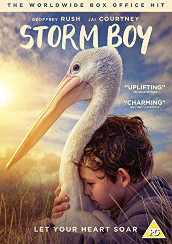 Boy embracing a pelican against a sunset sky, “Storm Boy” DVD cover.