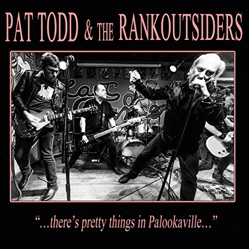Black and white photo of Pat Todd & The Rankoutsiders performing onstage.