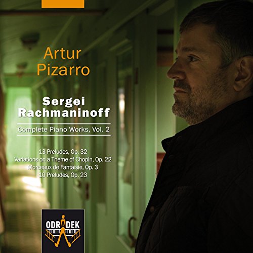 "CD cover with a man in a dark hallway, text listing musical compositions."